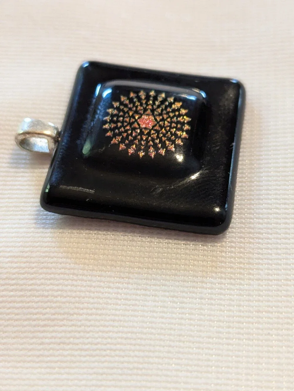 Black Pendant Featuring A Geometric Firework Pattern With Pink Center Handmade